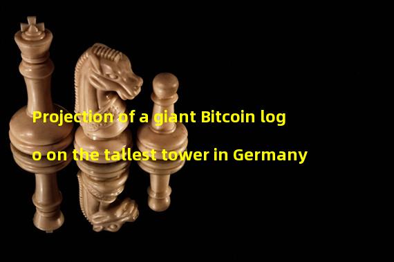 Projection of a giant Bitcoin logo on the tallest tower in Germany
